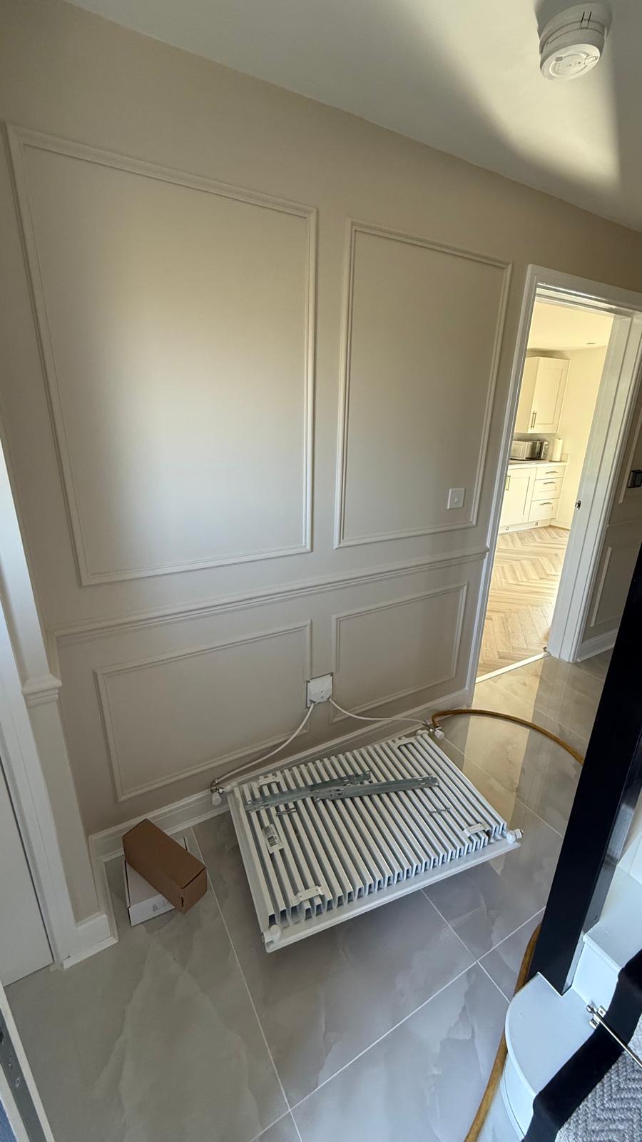 Old horizontal radiator on the floor during removal stage in Bloxwich